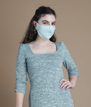 Woman posing wearing Multicolor The Essential Face Mask Multipack in Seafoam (Set of 3) from Connected Apparel