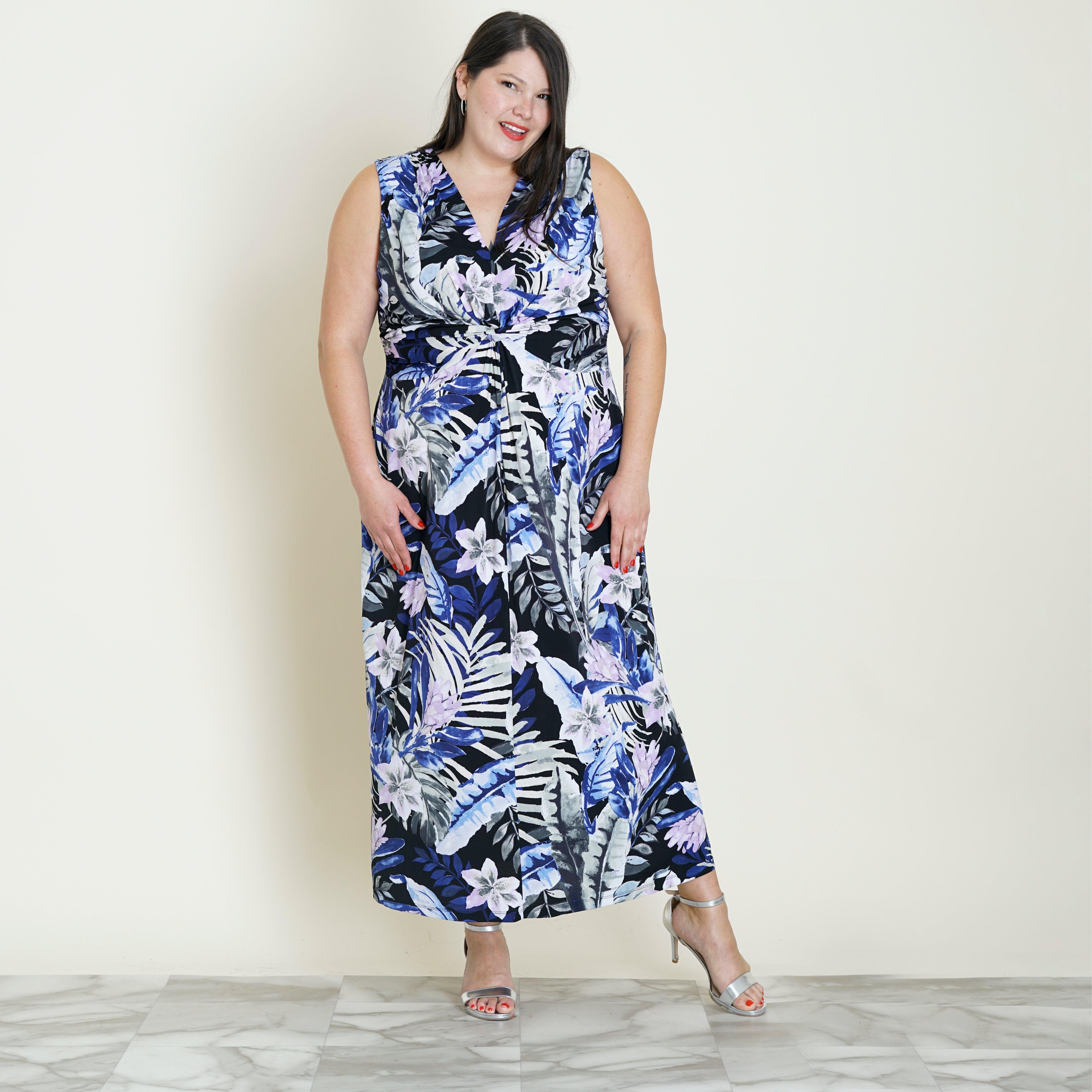 Woman posing wearing Blue Reese Knotted Tropical Maxi Dress from Connected Apparel