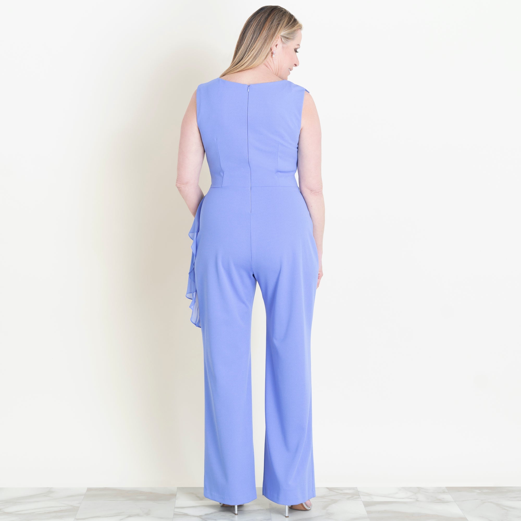 Woman posing wearing New Periwinkle Sara Periwinkle Jumpsuit from Connected Apparel