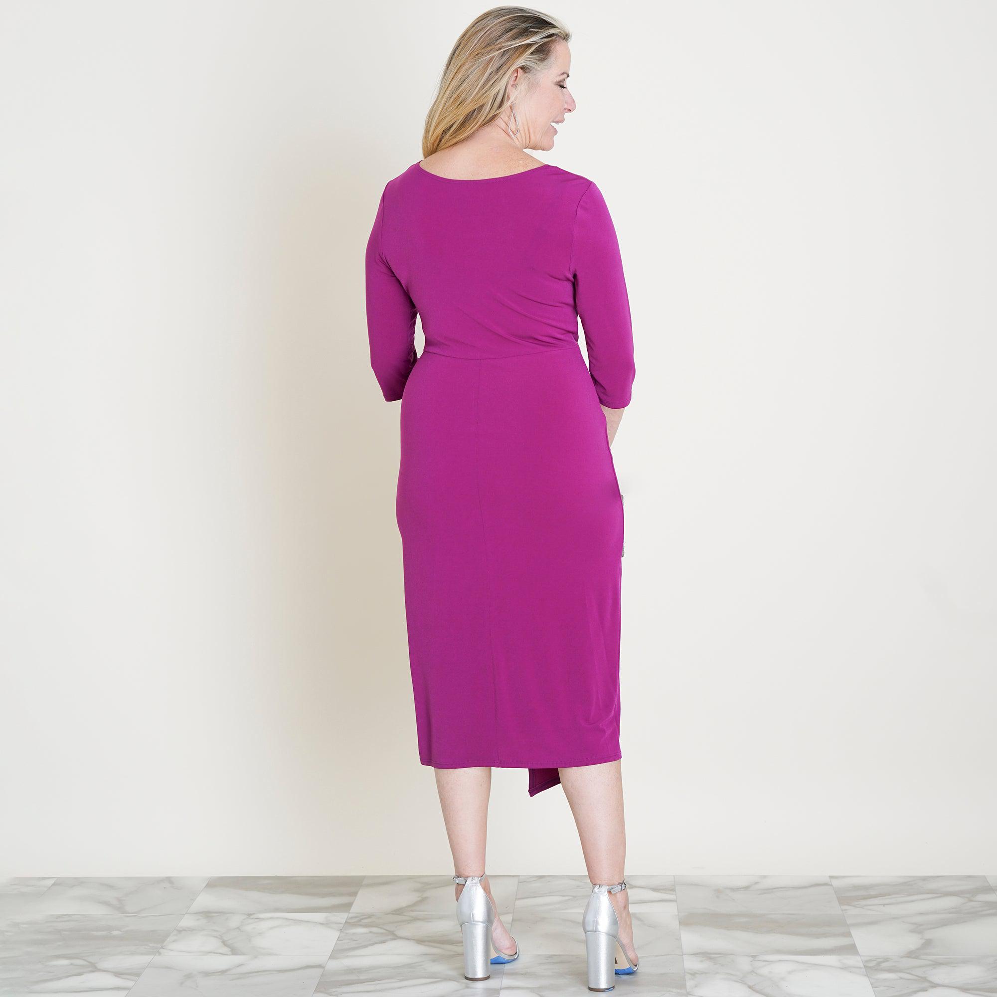 Woman posing wearing Magenta Selena Magenta Knot Dress from Connected Apparel