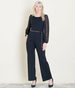 Woman posing wearing Black Sheryl Long Sleeve Black Jumpsuit from Connected Apparel