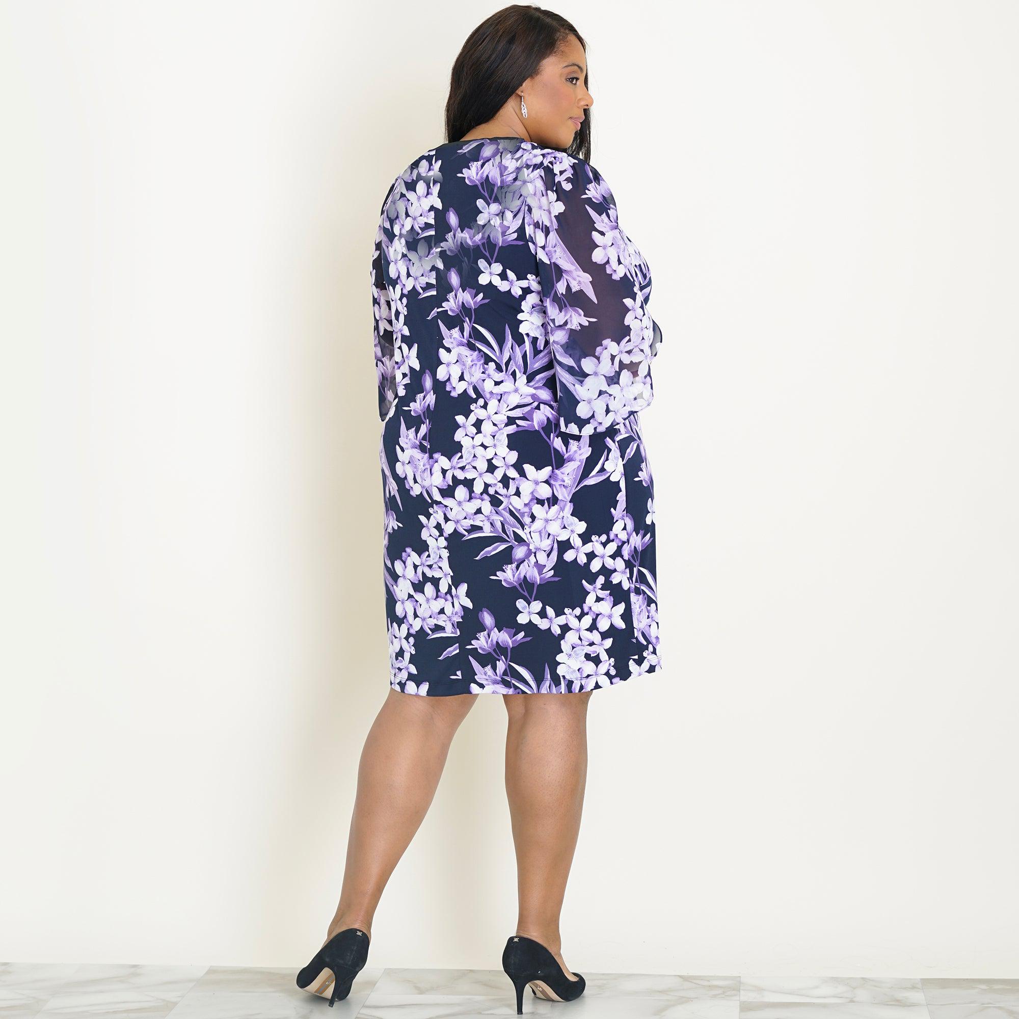 Woman posing wearing Navy/Lavender Stevie Navy and Lavender Floral Sheath Dress from Connected Apparel
