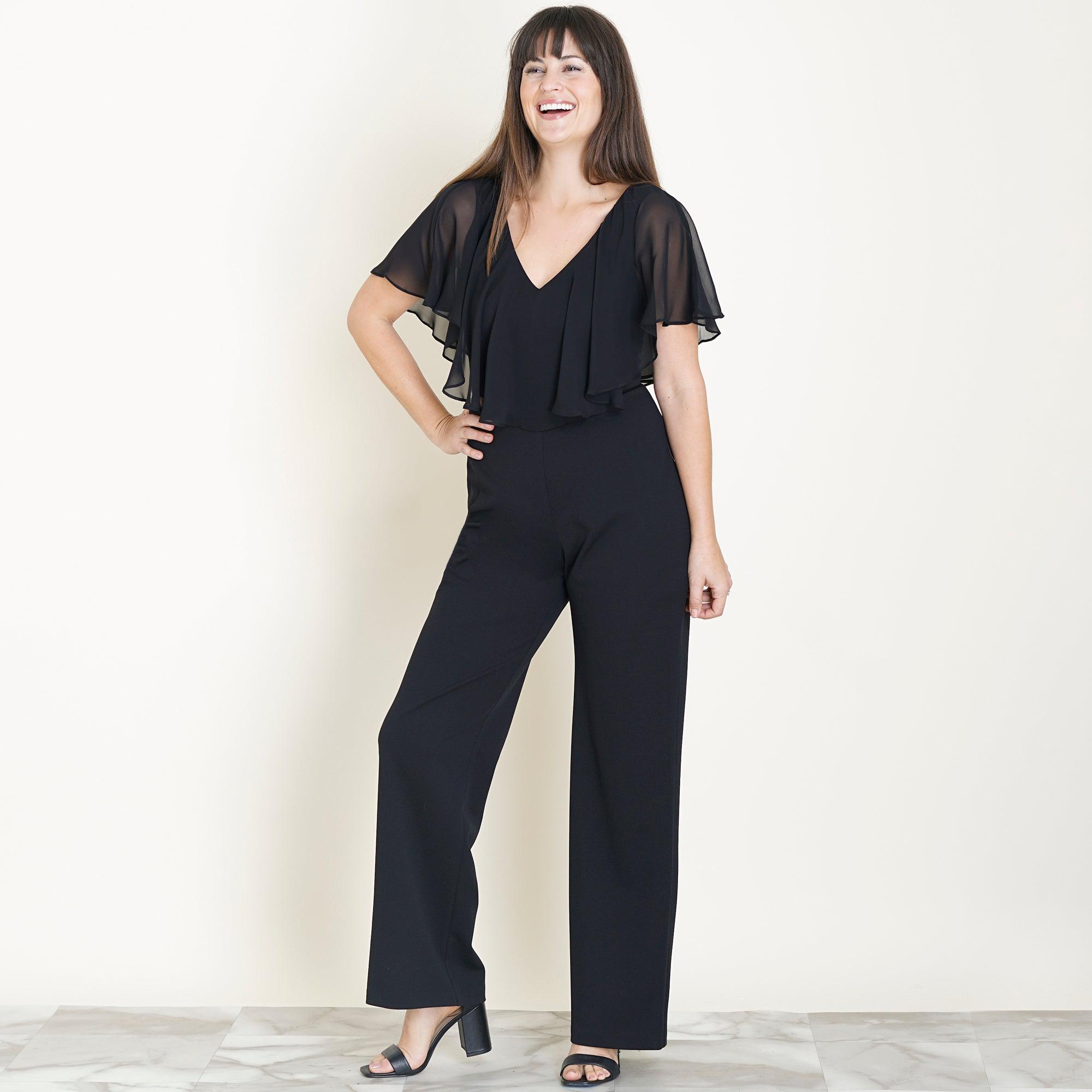 Woman posing wearing Black Sunny 2.0 Jumpsuit from Connected Apparel