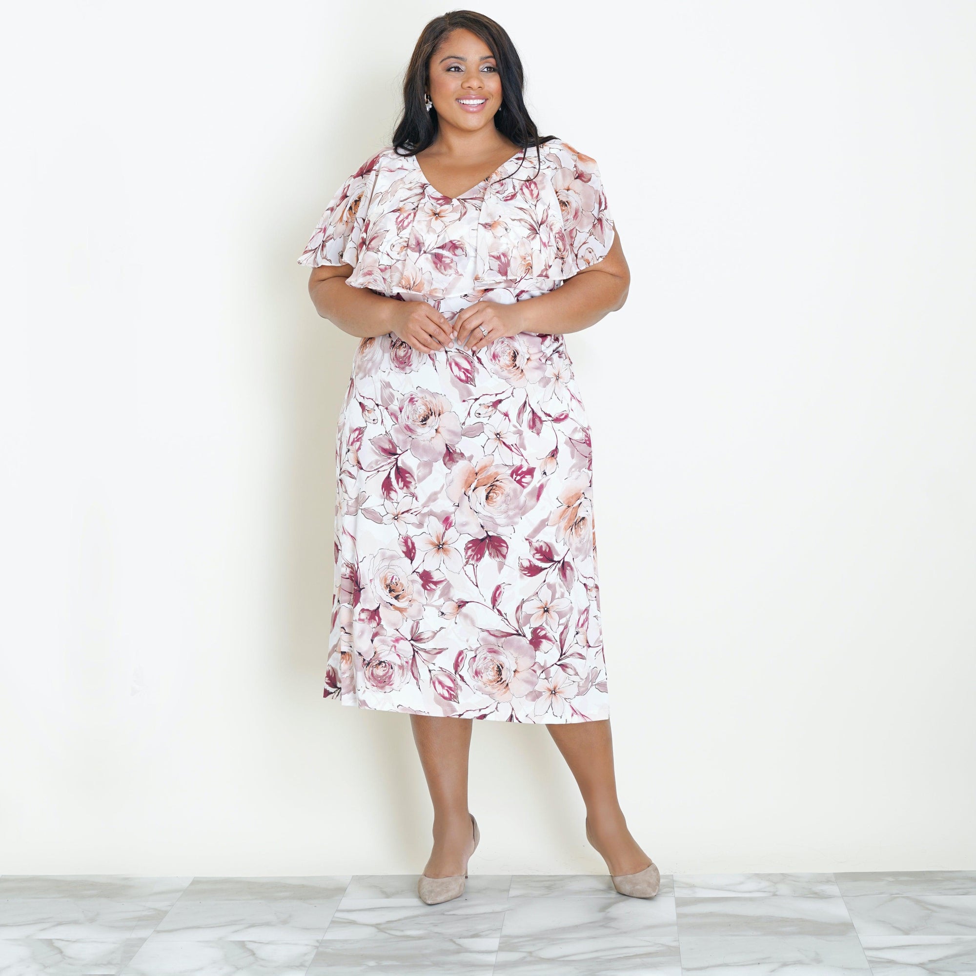 Woman posing wearing Cameo Sunny Cameo Floral Midi Dress from Connected Apparel