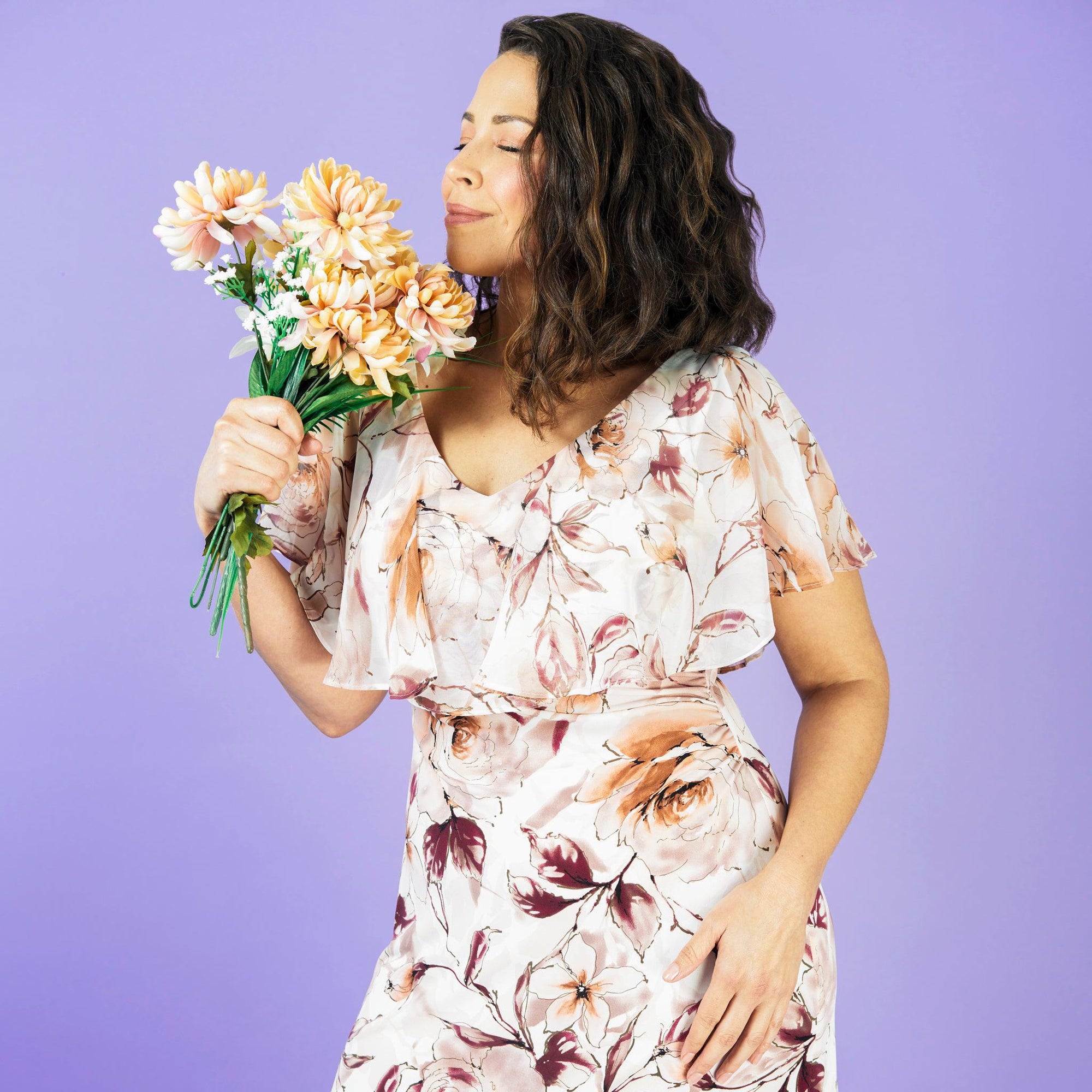 Woman posing wearing Cameo Sunny Cameo Floral Midi Dress from Connected Apparel