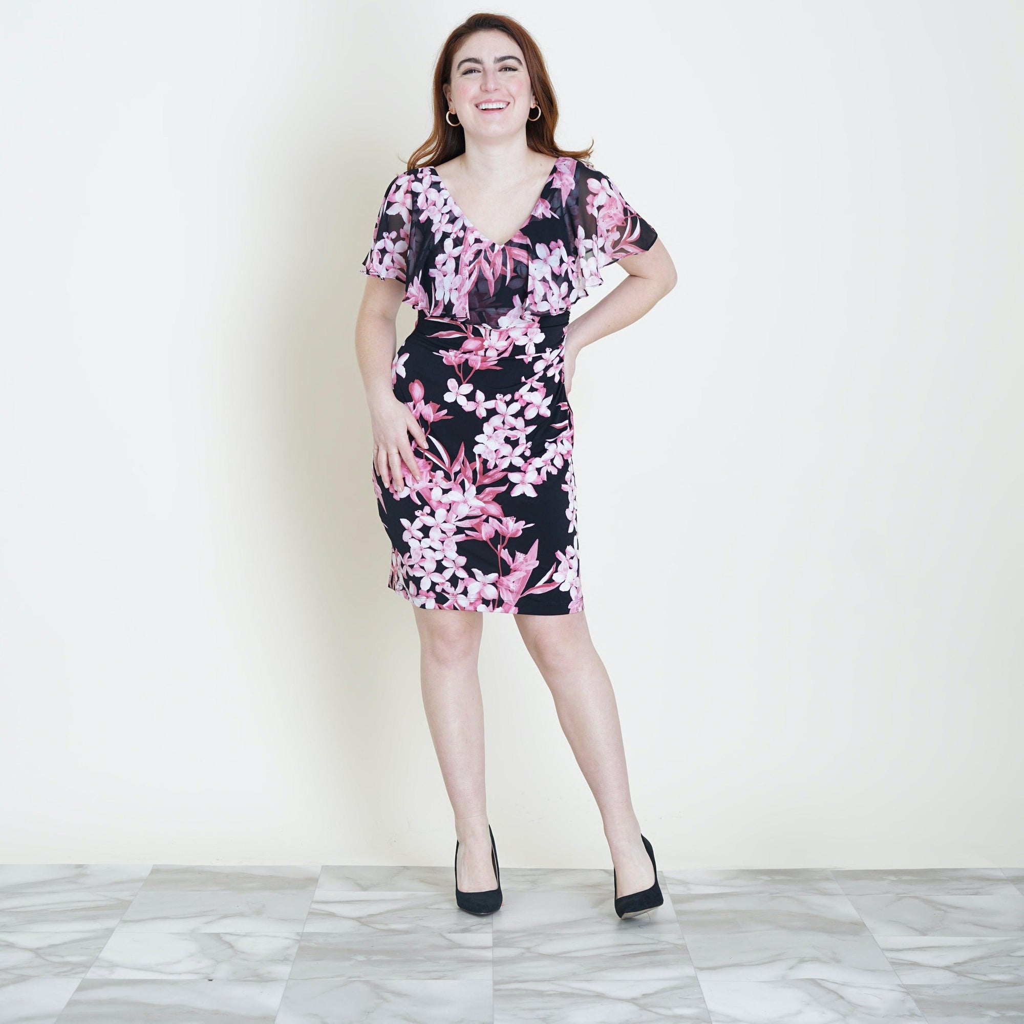 Woman posing wearing Rose Sunny Rose Floral Bodycon Dress from Connected Apparel