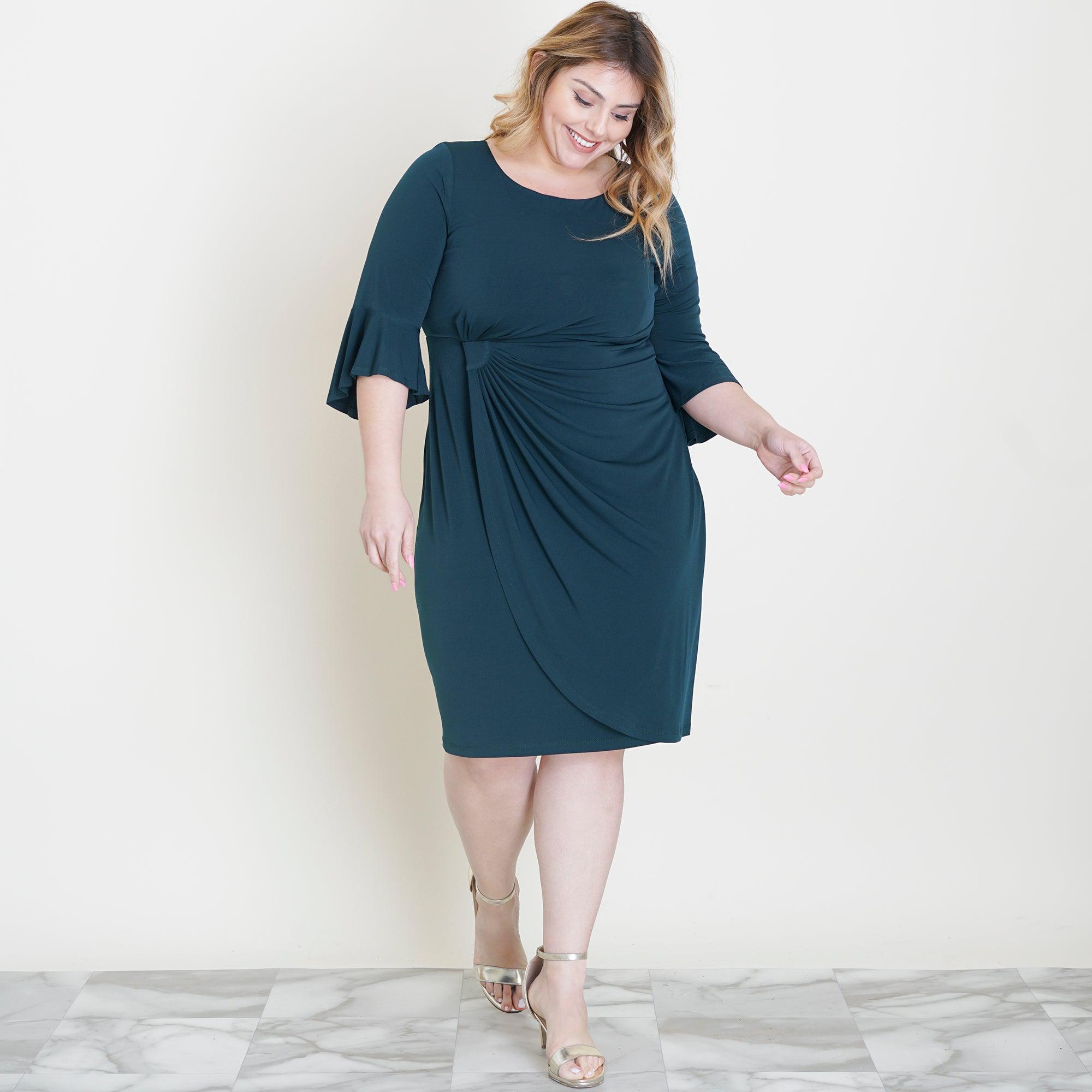 Woman posing wearing Hunter Lisa 2.0 Hunter Green Faux Wrap Dress from Connected Apparel
