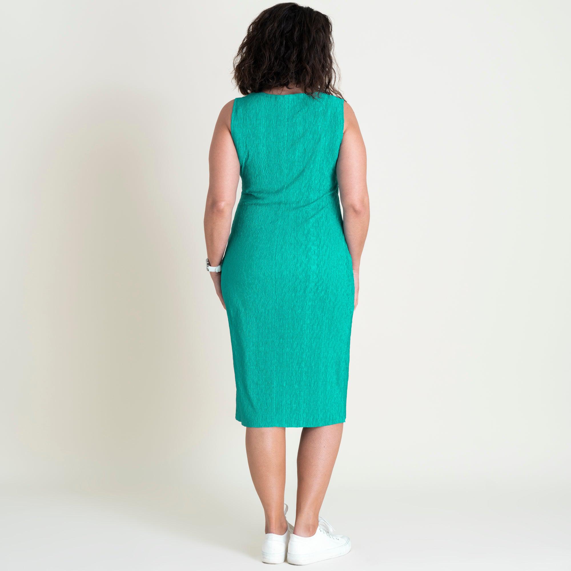 Woman posing wearing Bright Green Terra Bright Green Sheath Dress from Connected Apparel