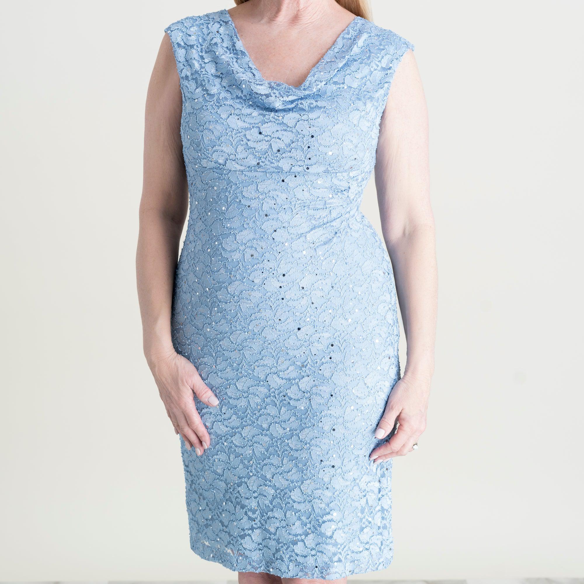 Woman posing wearing Sky Tina Sky Blue Sequin Lace Cocktail Dress from Connected Apparel
