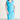 Woman posing wearing Turquoise Tina Turquoise Eyelet Cowl Neck Dress from Connected Apparel