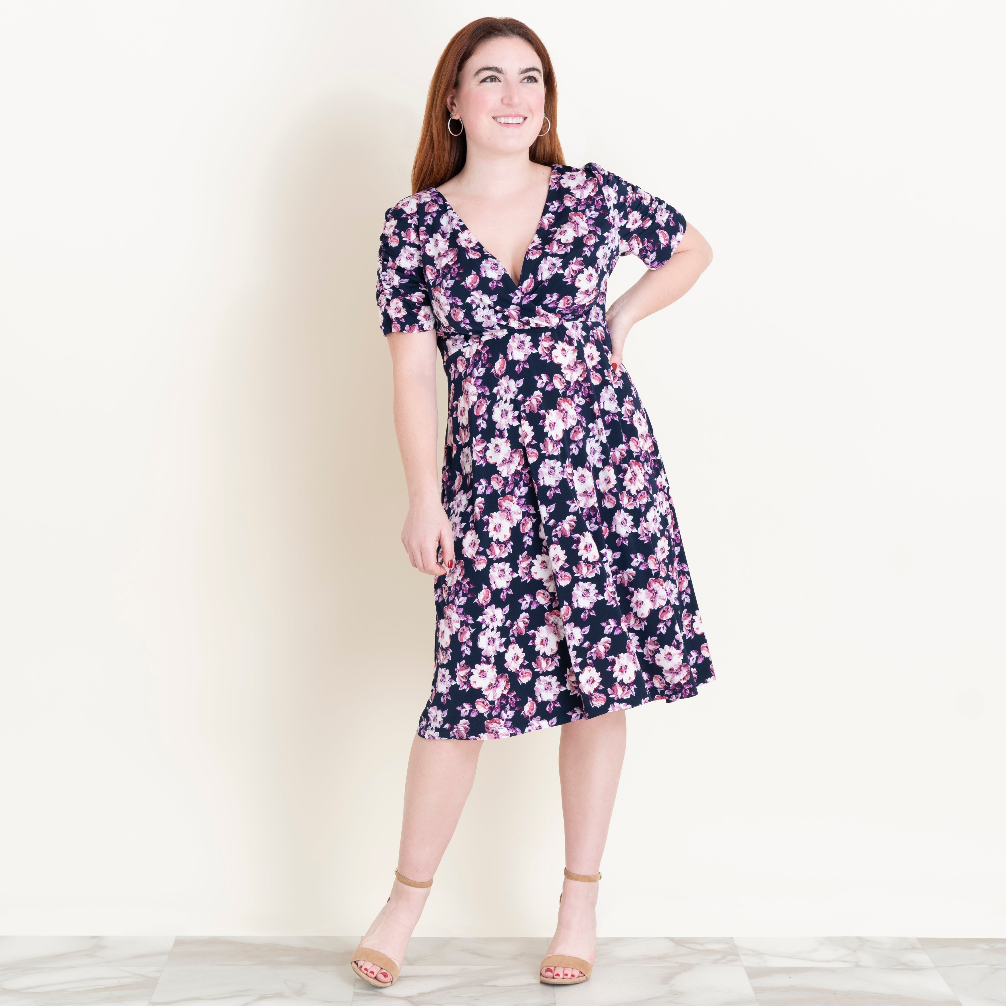 Woman posing wearing Navy/Mauve Valerie Floral Fit and Flare Dress from Connected Apparel